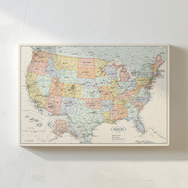 May include: A vintage-style map of the United States with state borders outlined in different colors. The map is printed on a canvas and includes a key with different colored pins indicating locations. The text "MALORY & TYLER" is printed in the bottom right corner.
