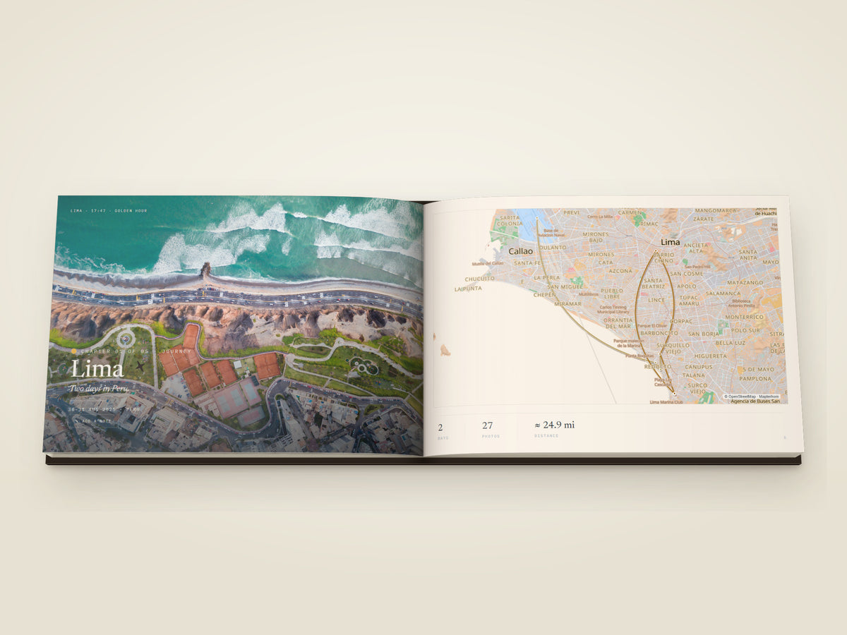 The same A4 landscape hardcover Travel Book, open on the table. A chapter opening across both pages — the Lima coast from above — a green clifftop park and the surf below it — filling the left page beneath the place name, facing a map of the roads around Lima