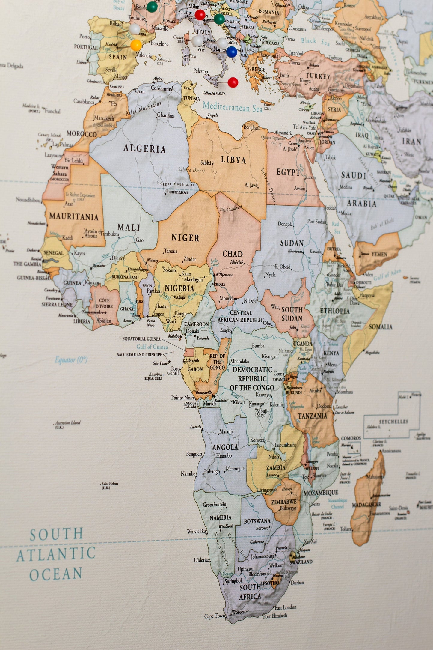Vibrant Tones- World map to track world travels of Wanderlust Travelers to push pins where they have traveled. Can be used to push pins into to show past and future travels, for singles, couples, or families. In Foamboard or Canvas to hold push pins. Warm colors for cozy home vibes