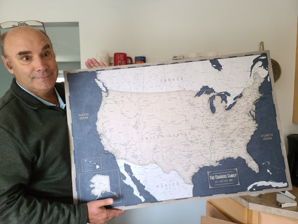 Customer push-pin map on a wall