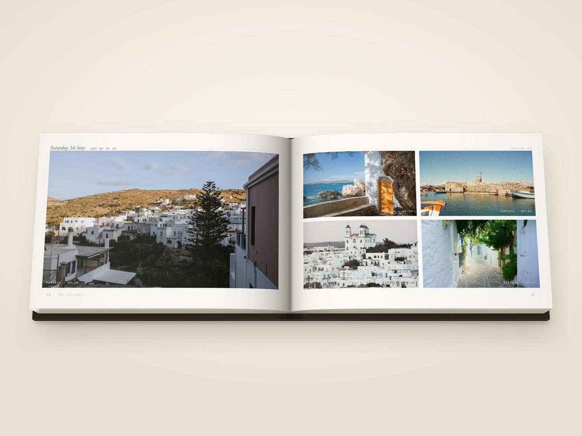 The same A5 landscape softcover Travel Book, open on the table. Two printed pages — five more from Parikia — the harbour front, a whitewashed doorway above the sea, the old harbour and its fort, a white church over the town and a lane shaded by vines