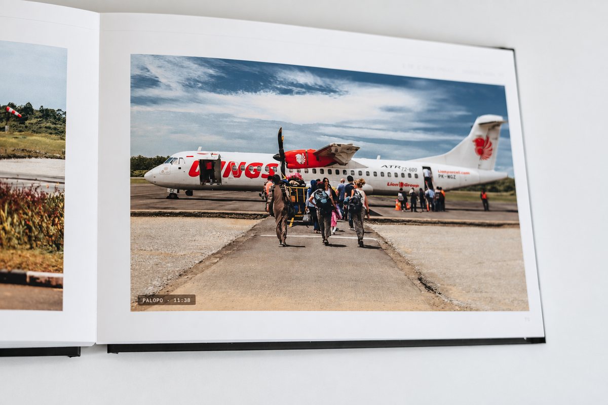 A whole page for one photograph: boarding a Wings Air flight at Palopo, 11:38