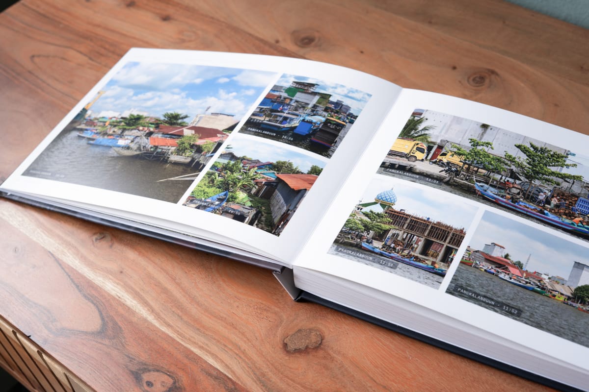 Boats and stilt houses: one day, laid out across both pages