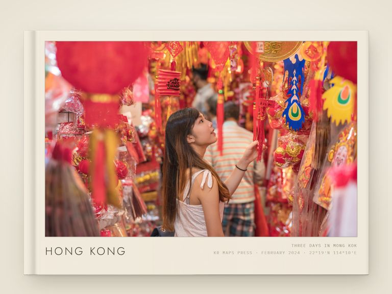 Gallery mount &mdash; an A4 landscape Travel Book front cover, a real render from a lifestyle photograph