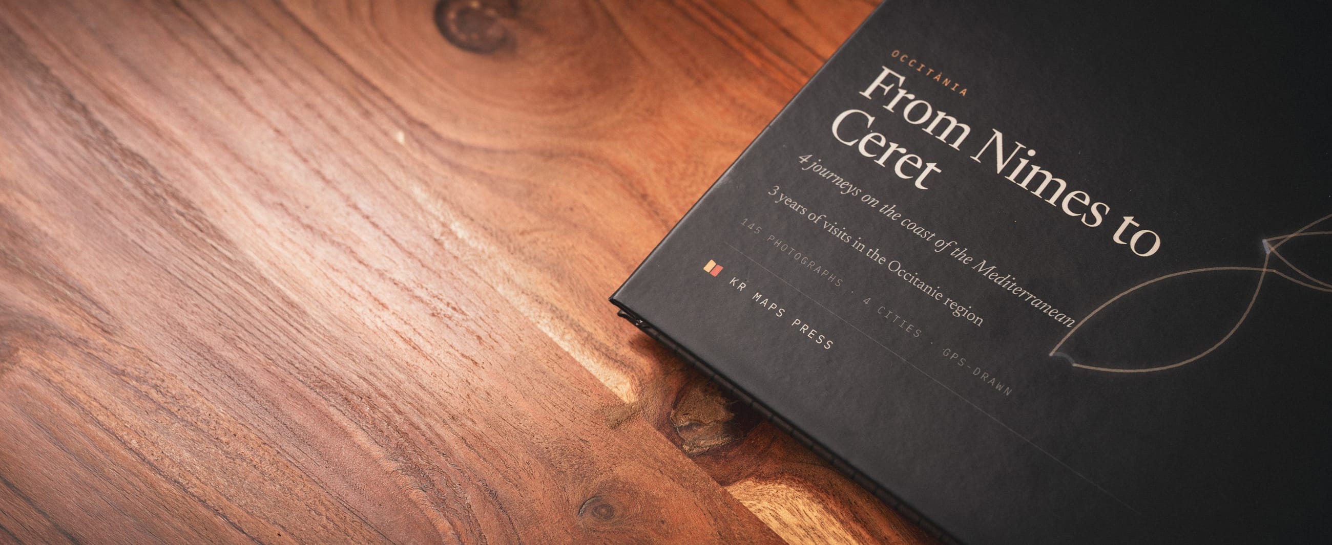 A finished Travel Book lying on a walnut table