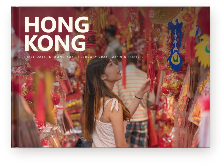 A Travel Book, closed on a table &mdash; a new-year market in Hong Kong