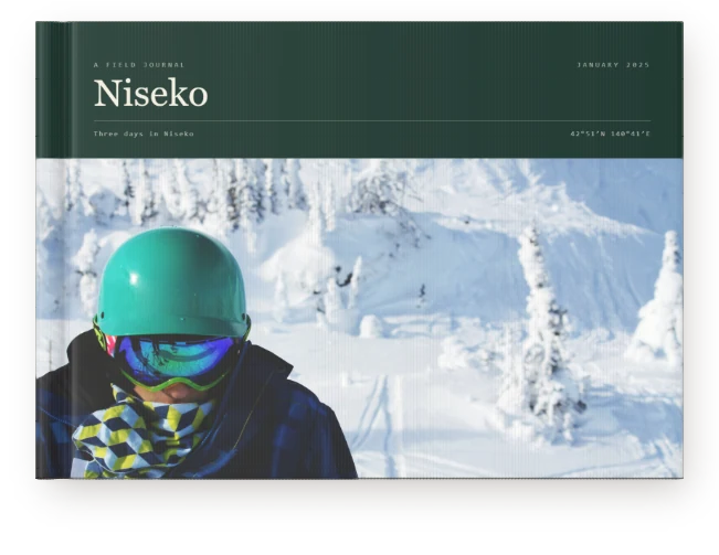 A Travel Book, closed on a table &mdash; deep snow at Niseko