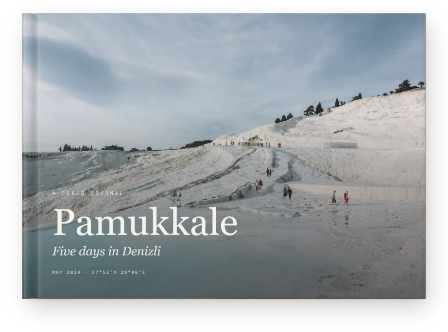 A Travel Book, closed on a table &mdash; The white terraces at Pamukkale