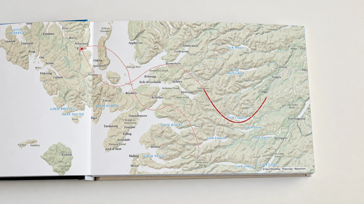 A printed map spread of Skye and the western Highlands with the trip's route to Loch Cluanie